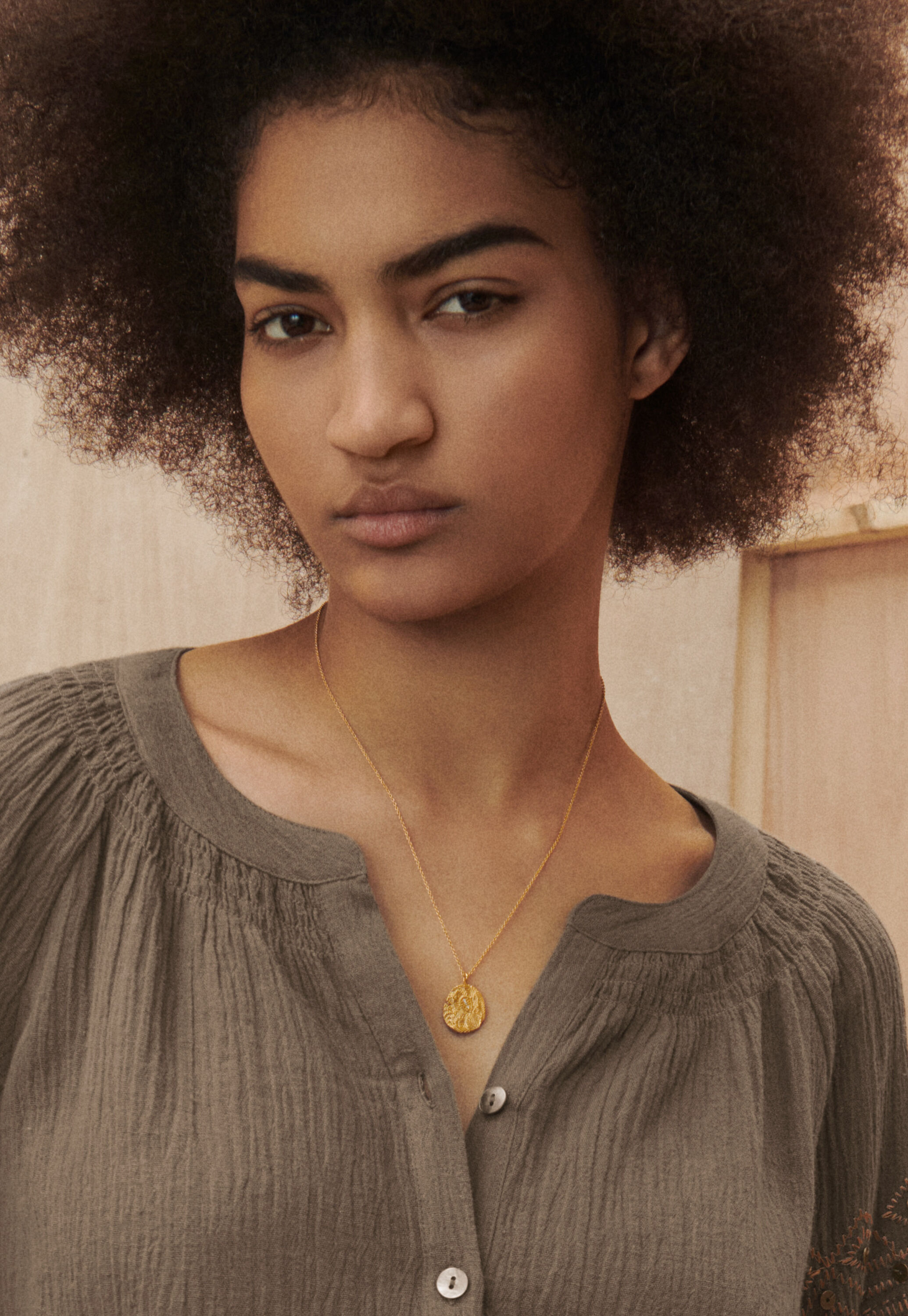 Small gold-pendant necklace