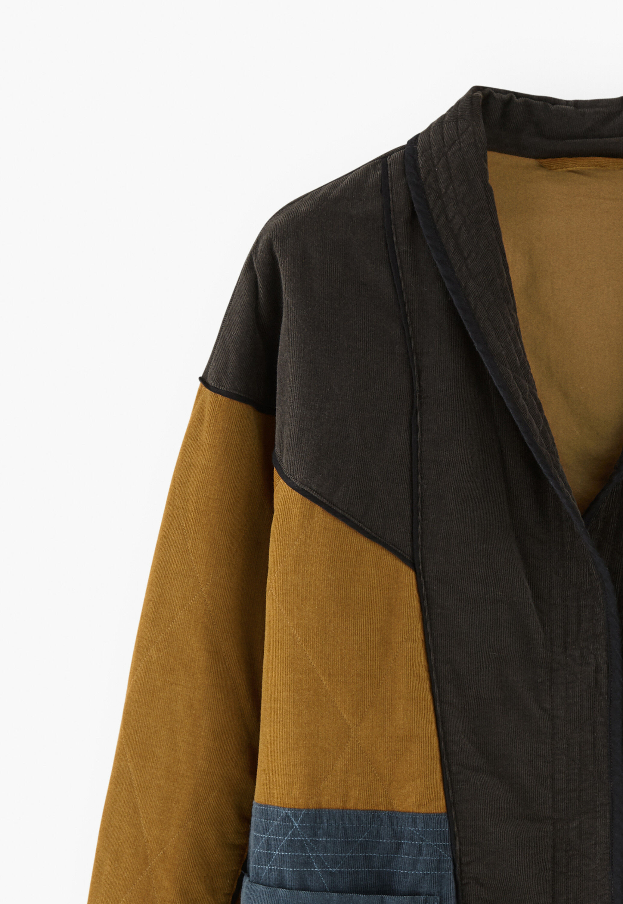 Panelled cord coat